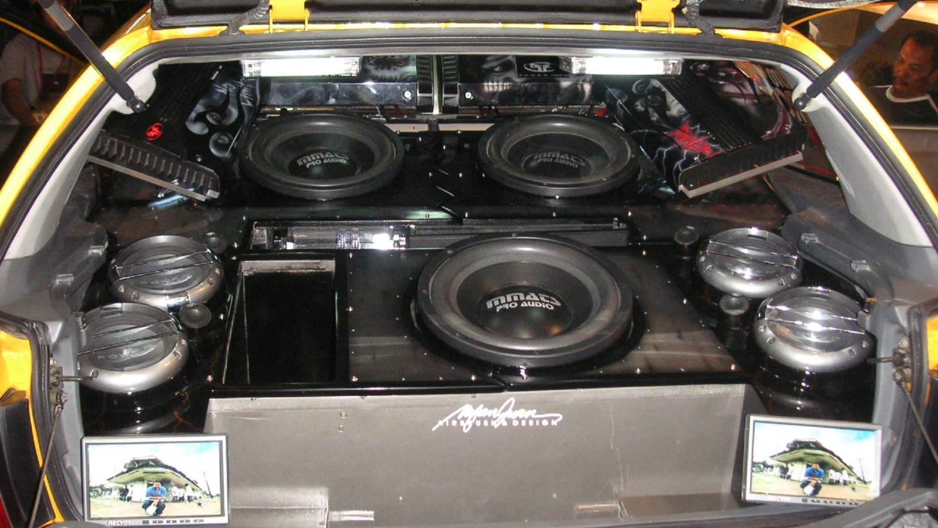 A parked hatchback showing off its bass stereo system