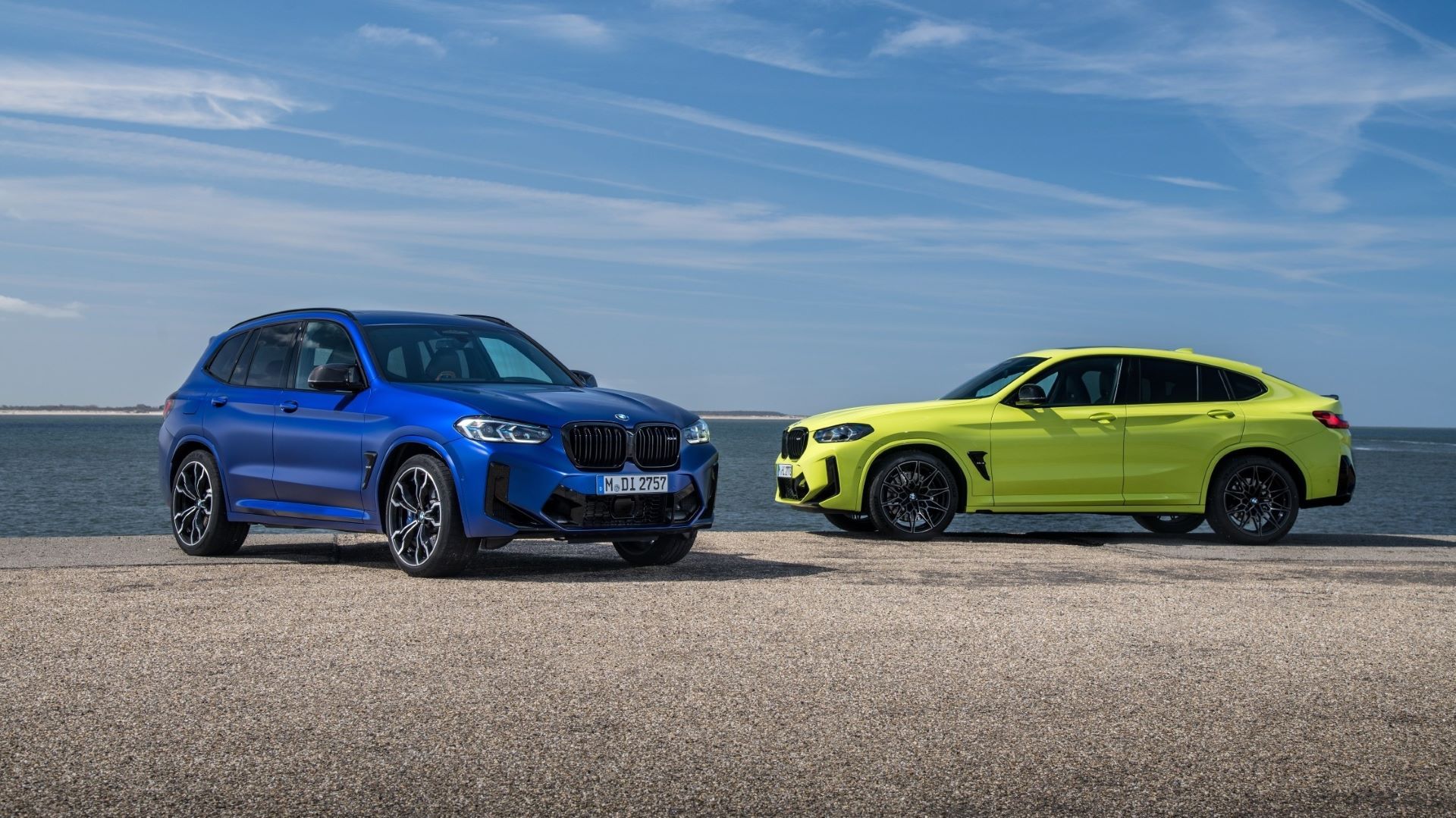 A side profile shot of the BMW X3 M and X4 M Competition models parked