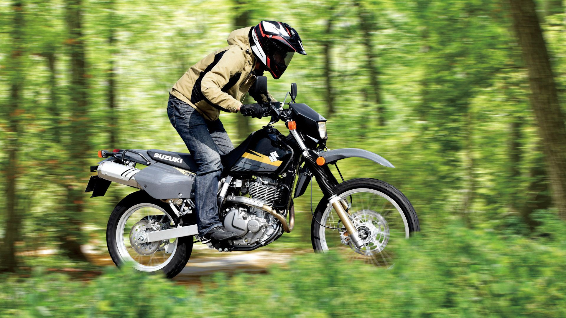 Black Suzuki DR650S navigating a trail