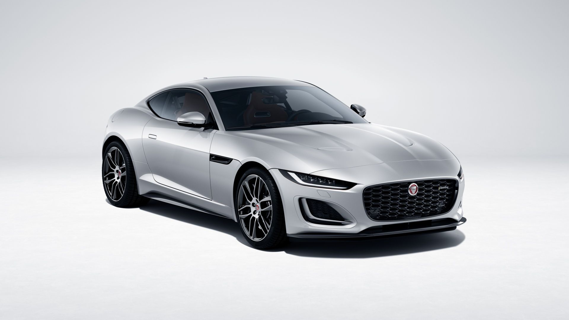 A front 3/4 studio shot of a Jaguar F TYPE R Dynamic Coupe