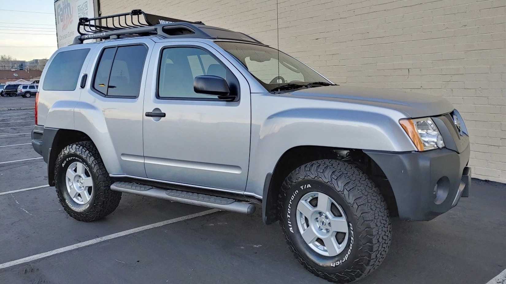 Front 3/4 shot of a silver 2007 Nissan Xterra S parked