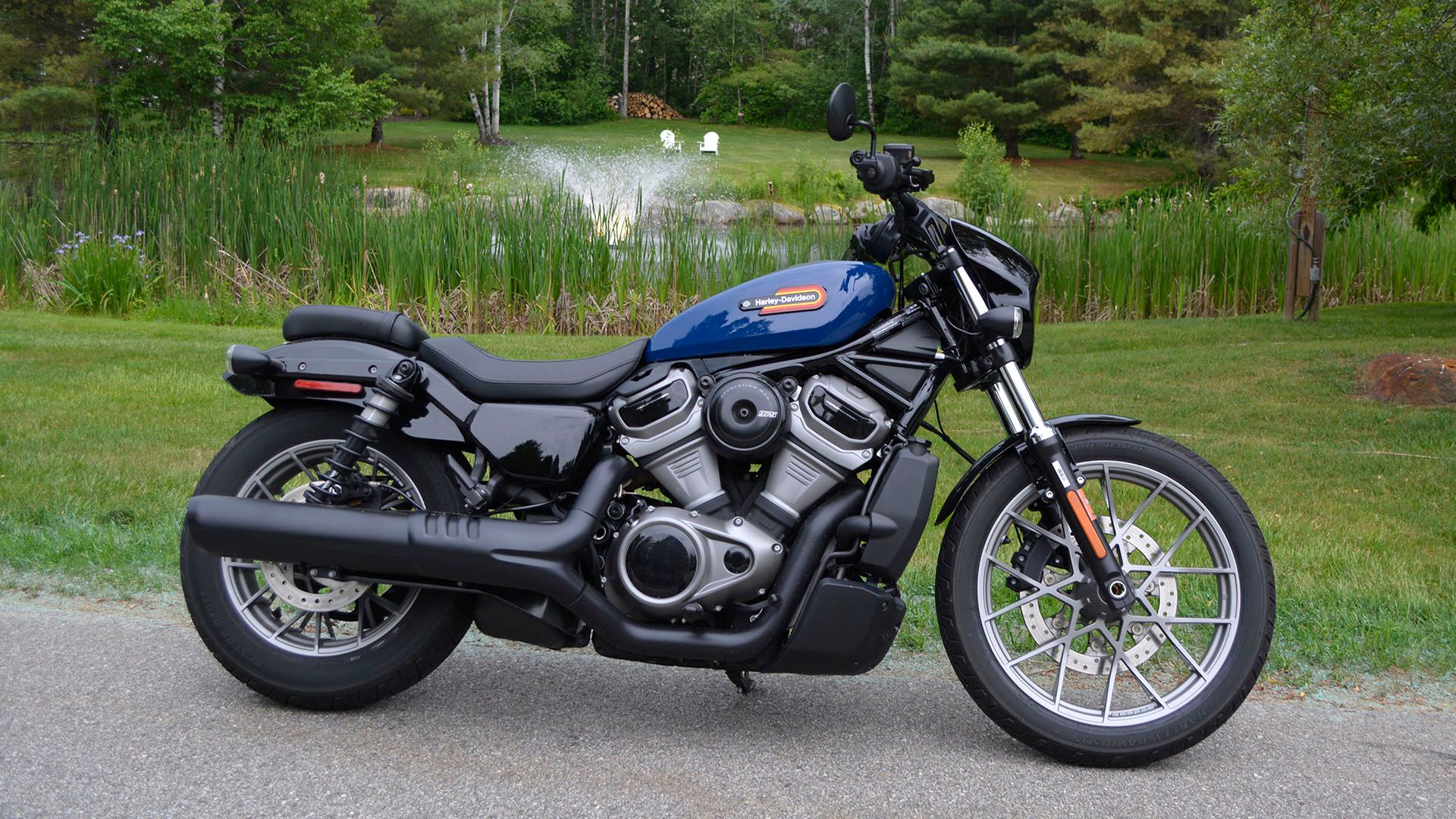 2023 Harley-Davidson Nightster Special parked by a pond.