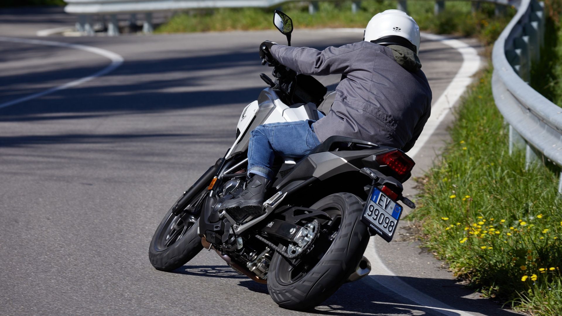 A rear 3/4 action shot of a HONDA NC750X