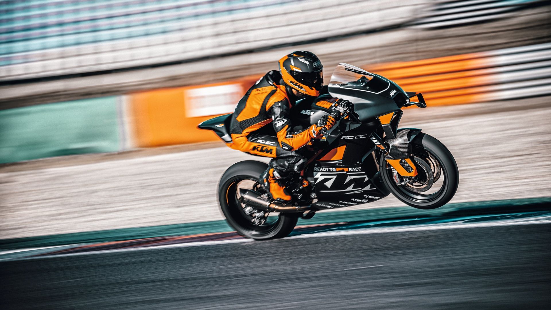 An action shot of a 2023 KTM RC 8C