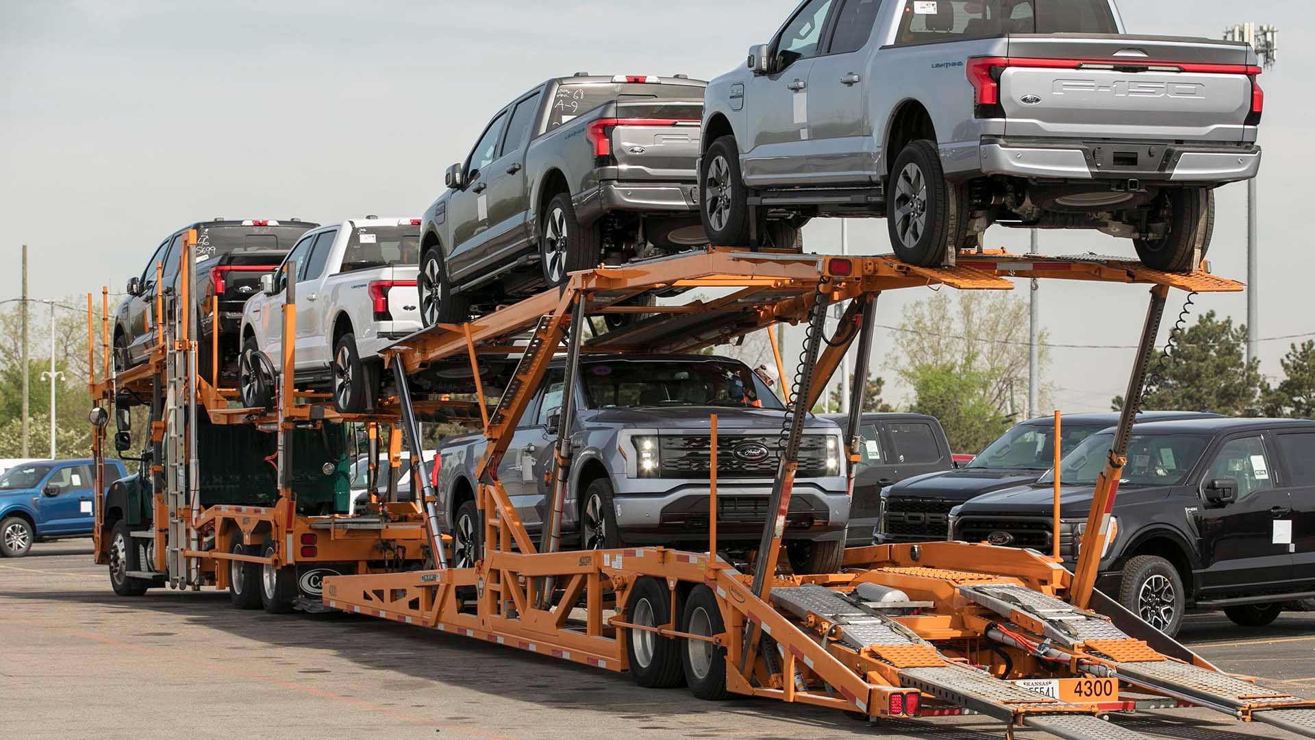 A fleet of Ford F-150 Lightning on a car carrier