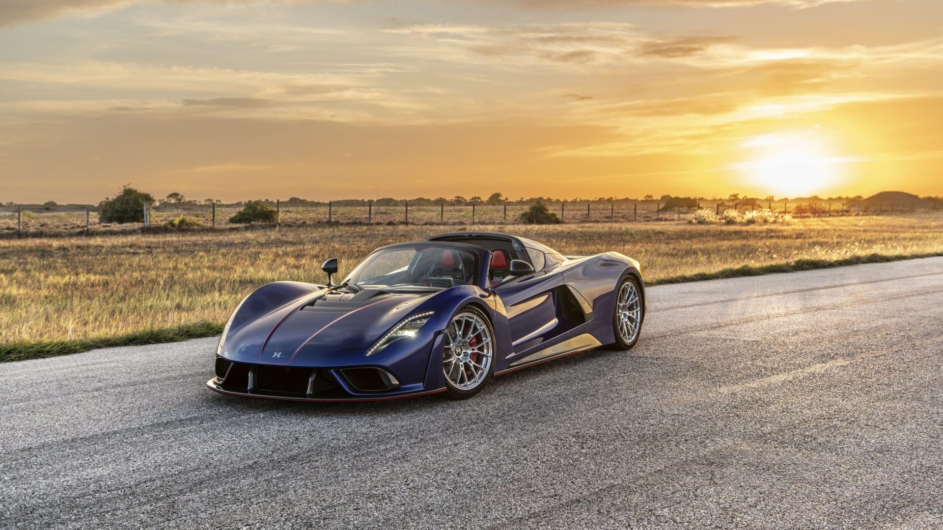 An front 3/4 shot of a Hennessey Venom F5 parked on a test track