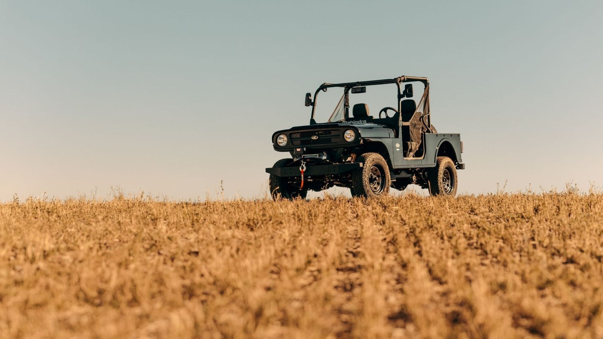 Front 3/4 shot of the Mahindra Roxor in a field