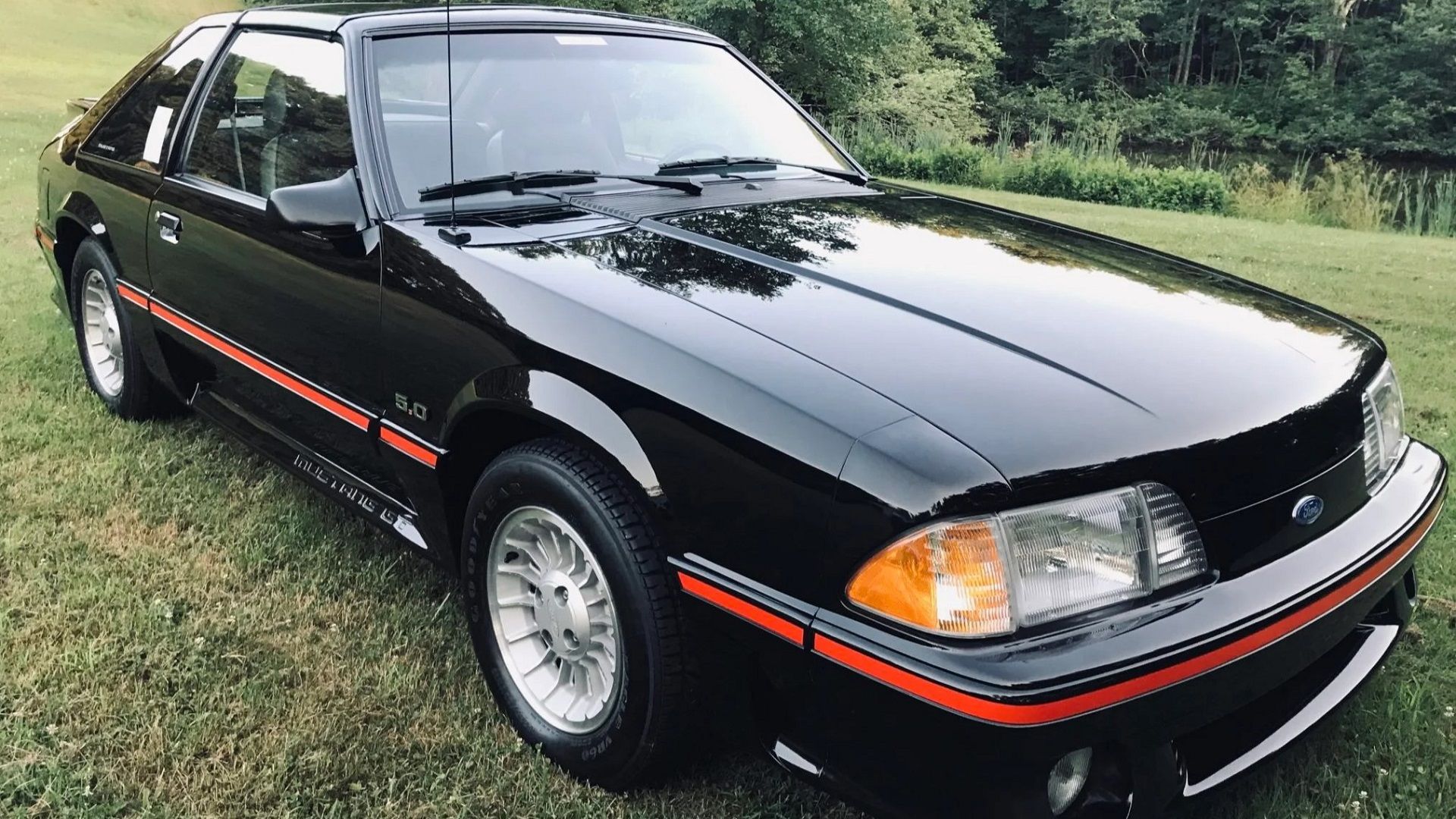 A parked 1987 Mustang Foxbody 5.0 on display