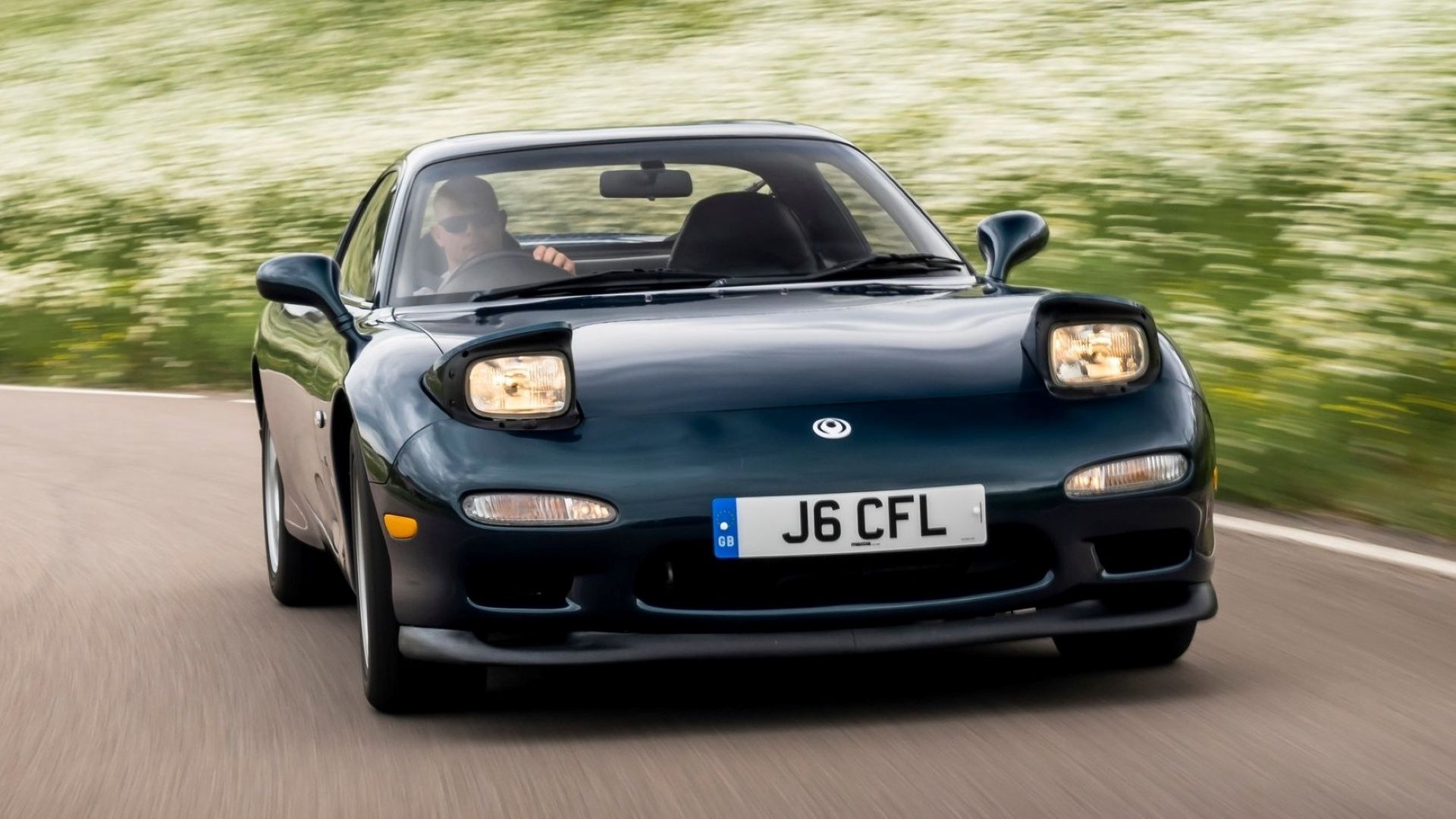 Front action shot of a 1992 Mazda RX7