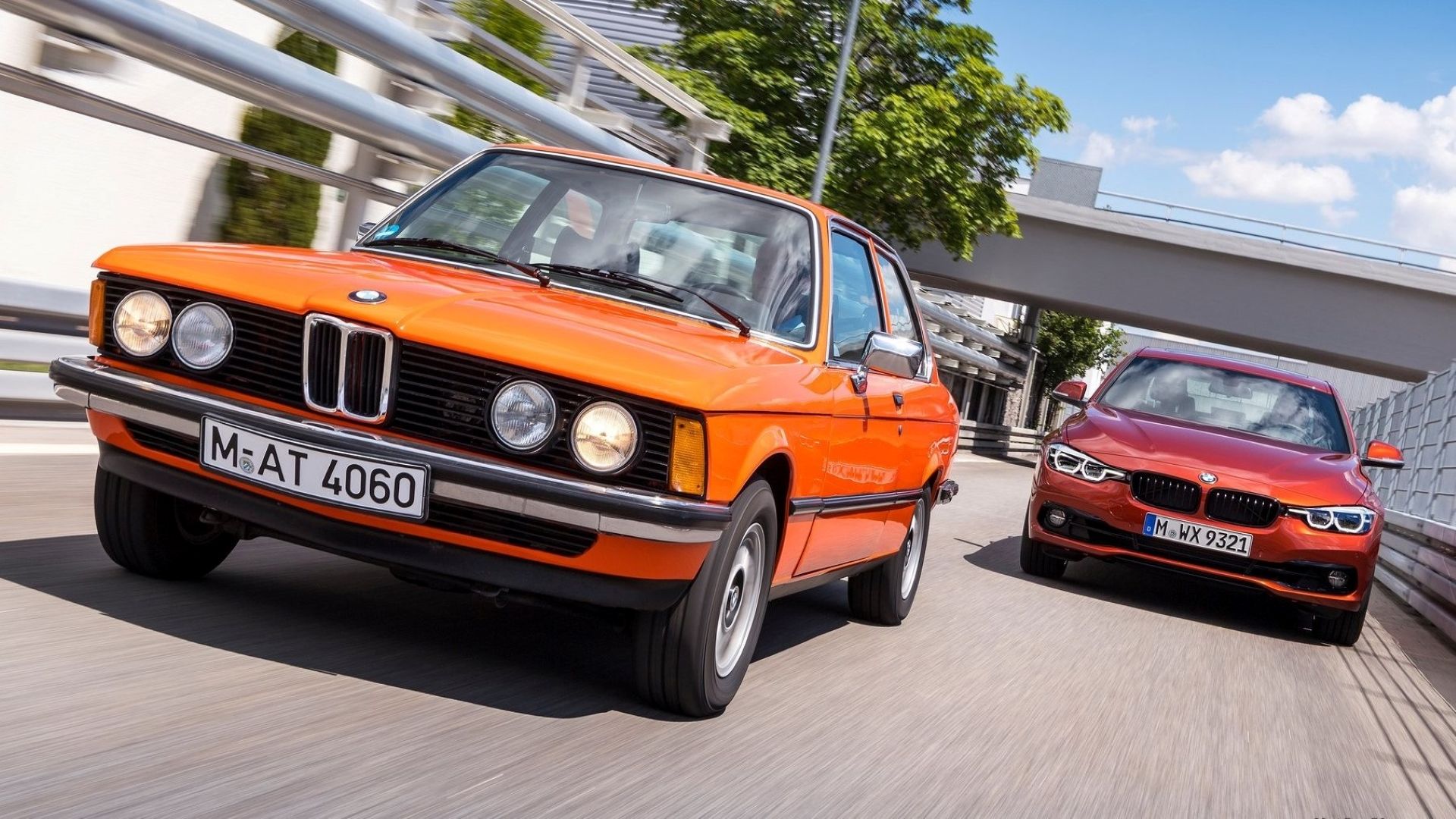 A 1975 E21 BMW 3 Series racing a modern F30 3 Series