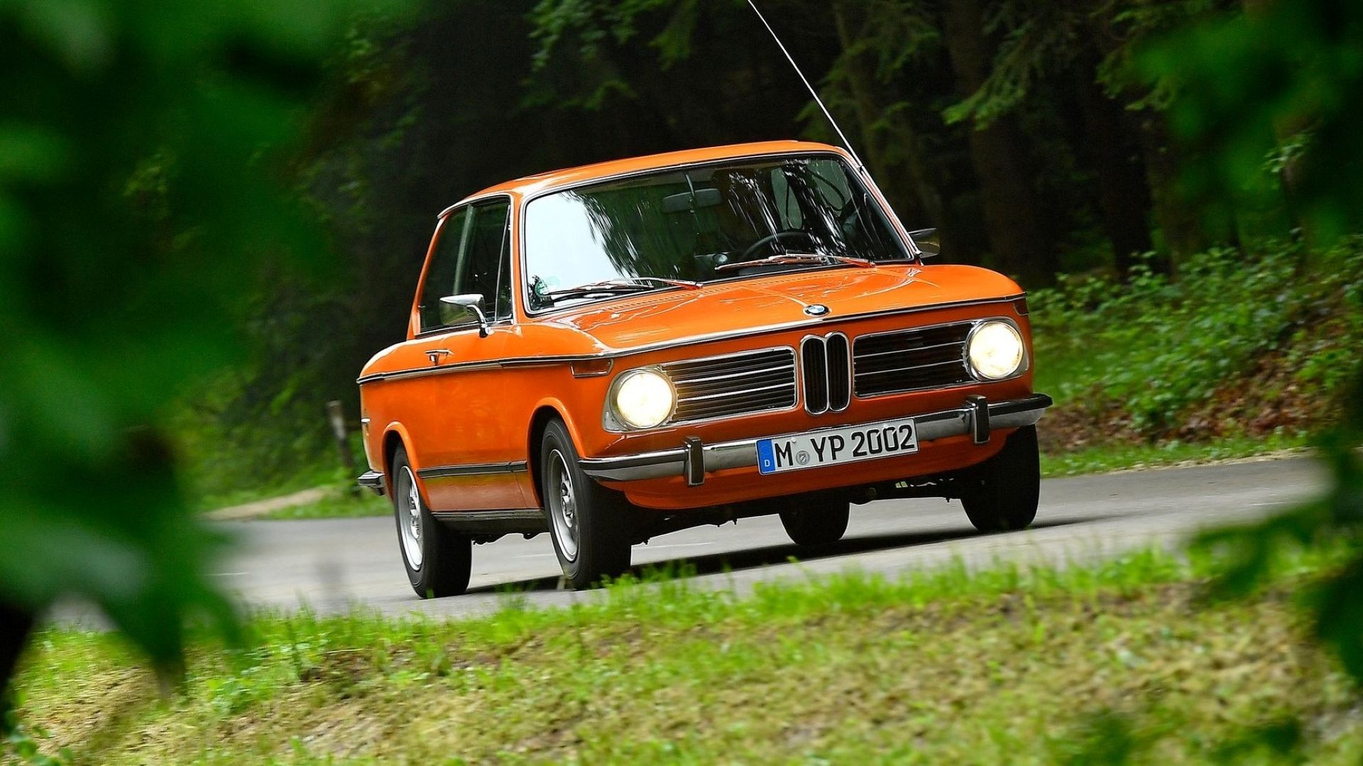 Front 3/4 action shot of a 1972 BMW 2002tii