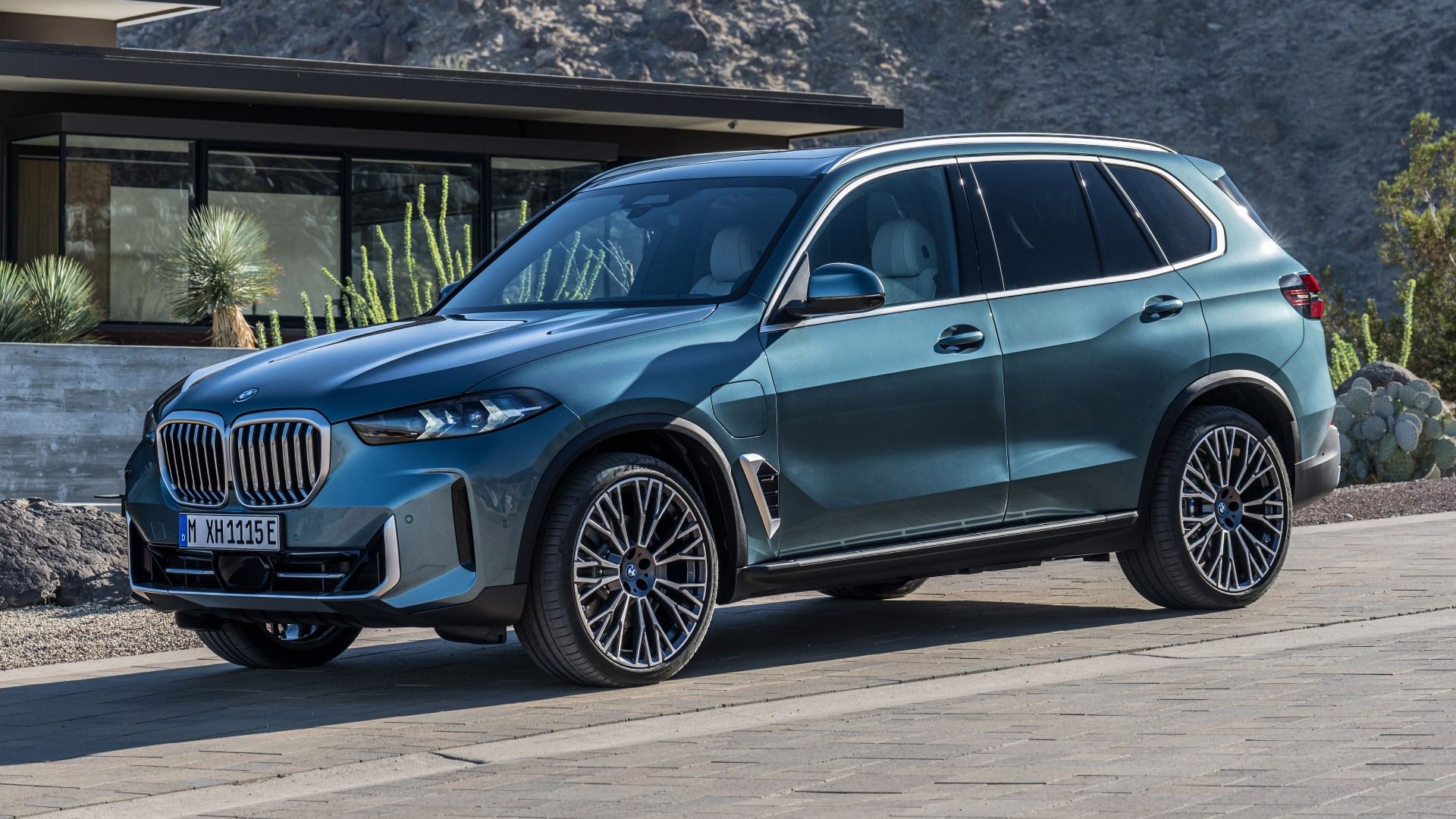 Blue BMW X5 xDrive50e parked