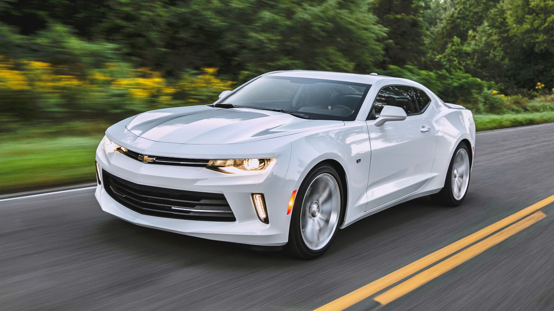 A front 3/4 action shot of a 2016 Chevrolet Camaro on the road