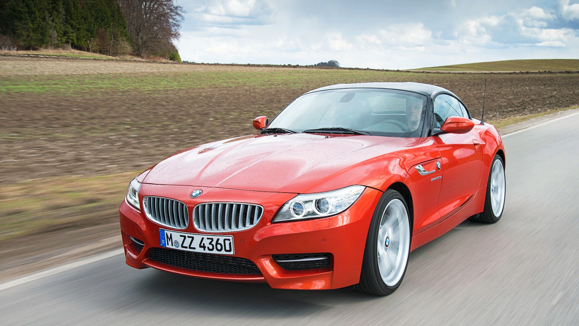 2014 BMW Z4 sDrive35i Roadster cruising on the road