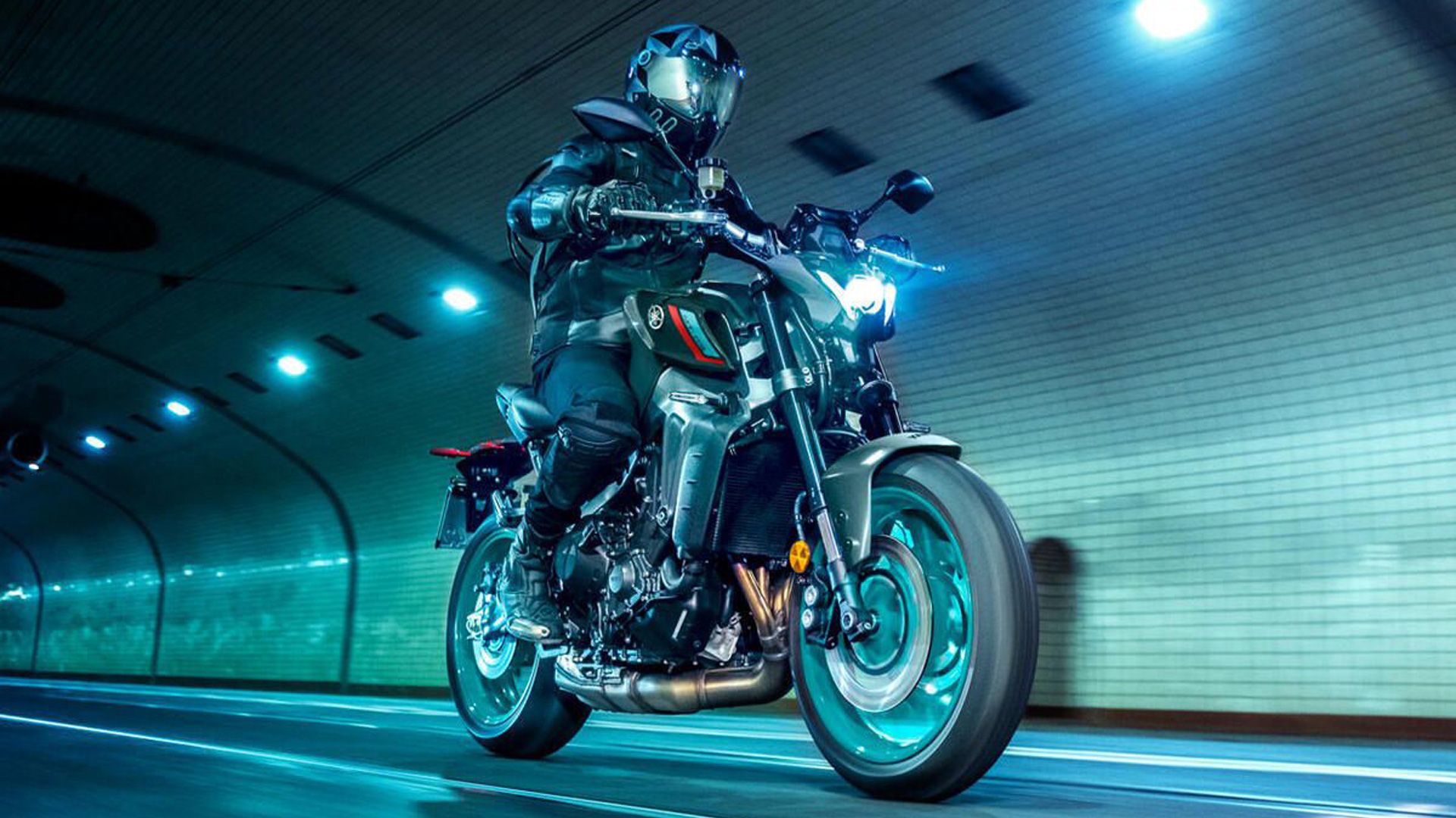 Image of a person driving a 2022 Yamaha MT-09 through a tunnel.