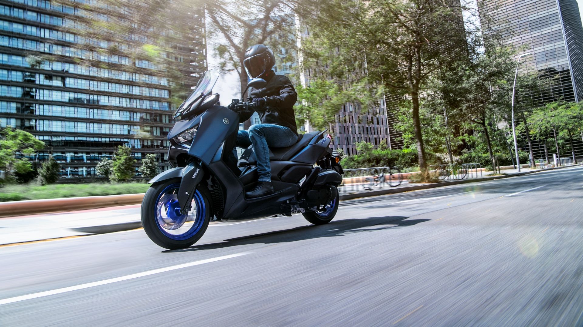 An action shot of a 2023 Yamaha XMAX