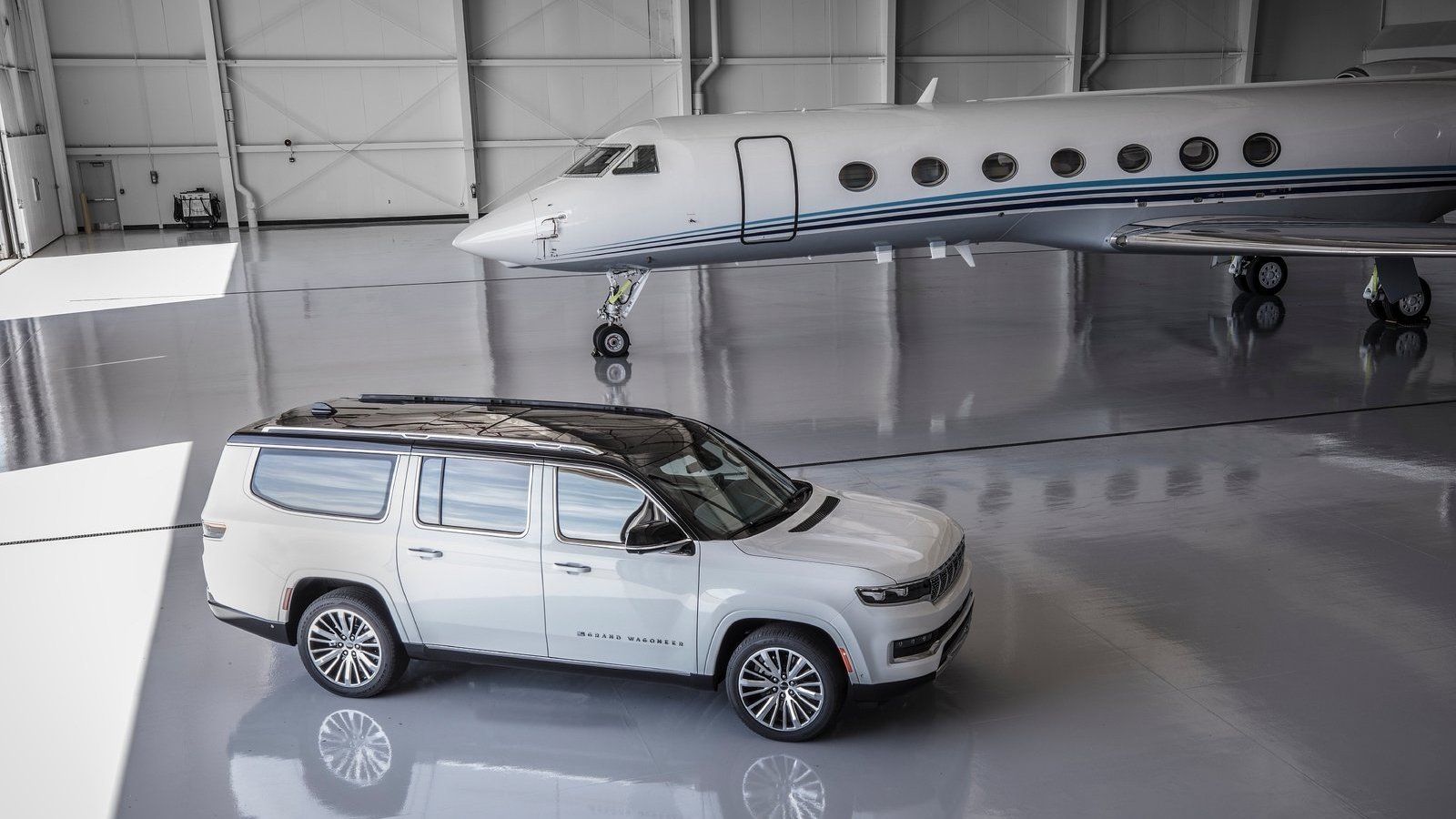 A 2024 Jeep Grand Wagoneer L and a private jet