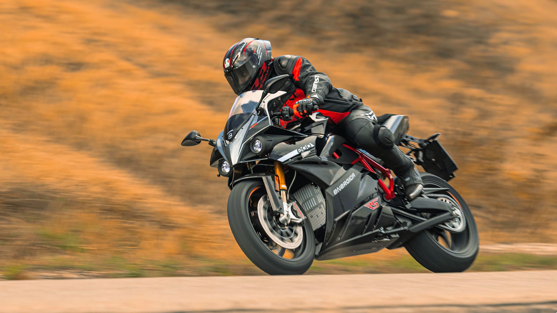 Black 2023 Energica Ego+ RS coming out of a curve