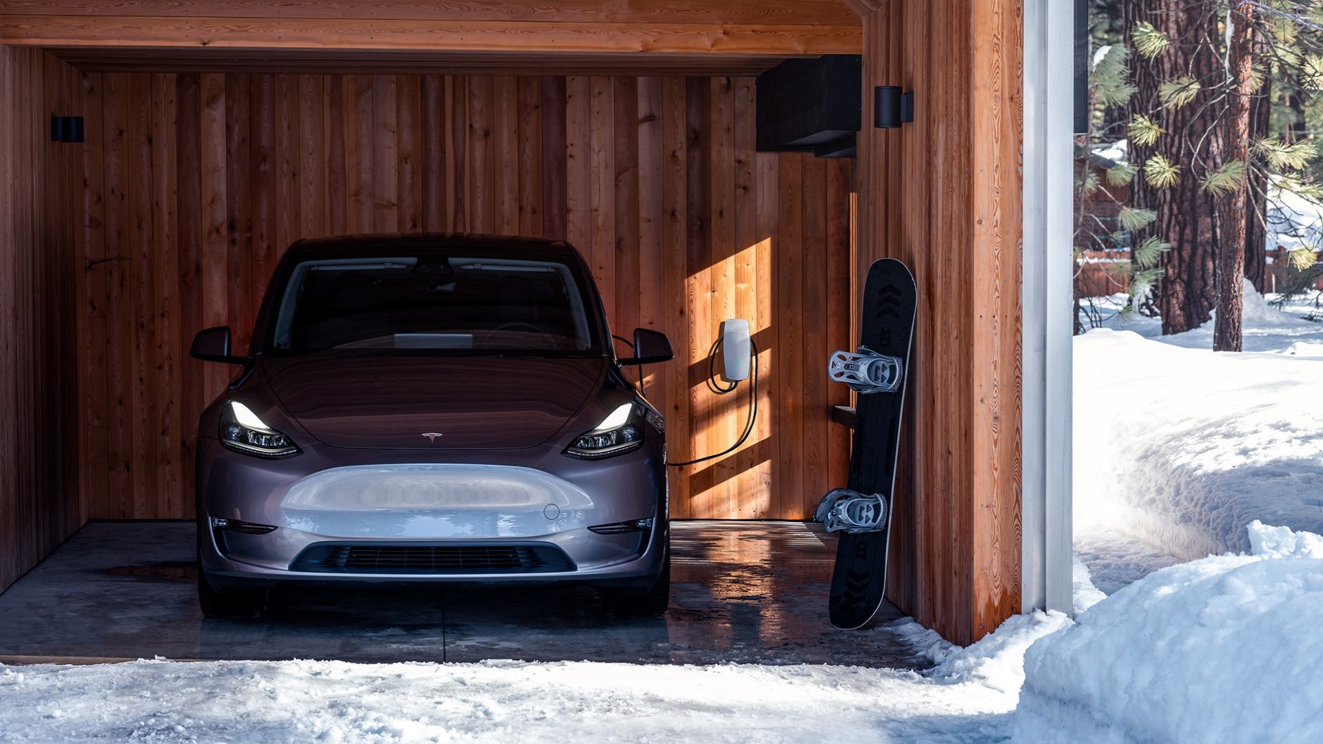 Front-view of the Tesla Model Y charging in the snow