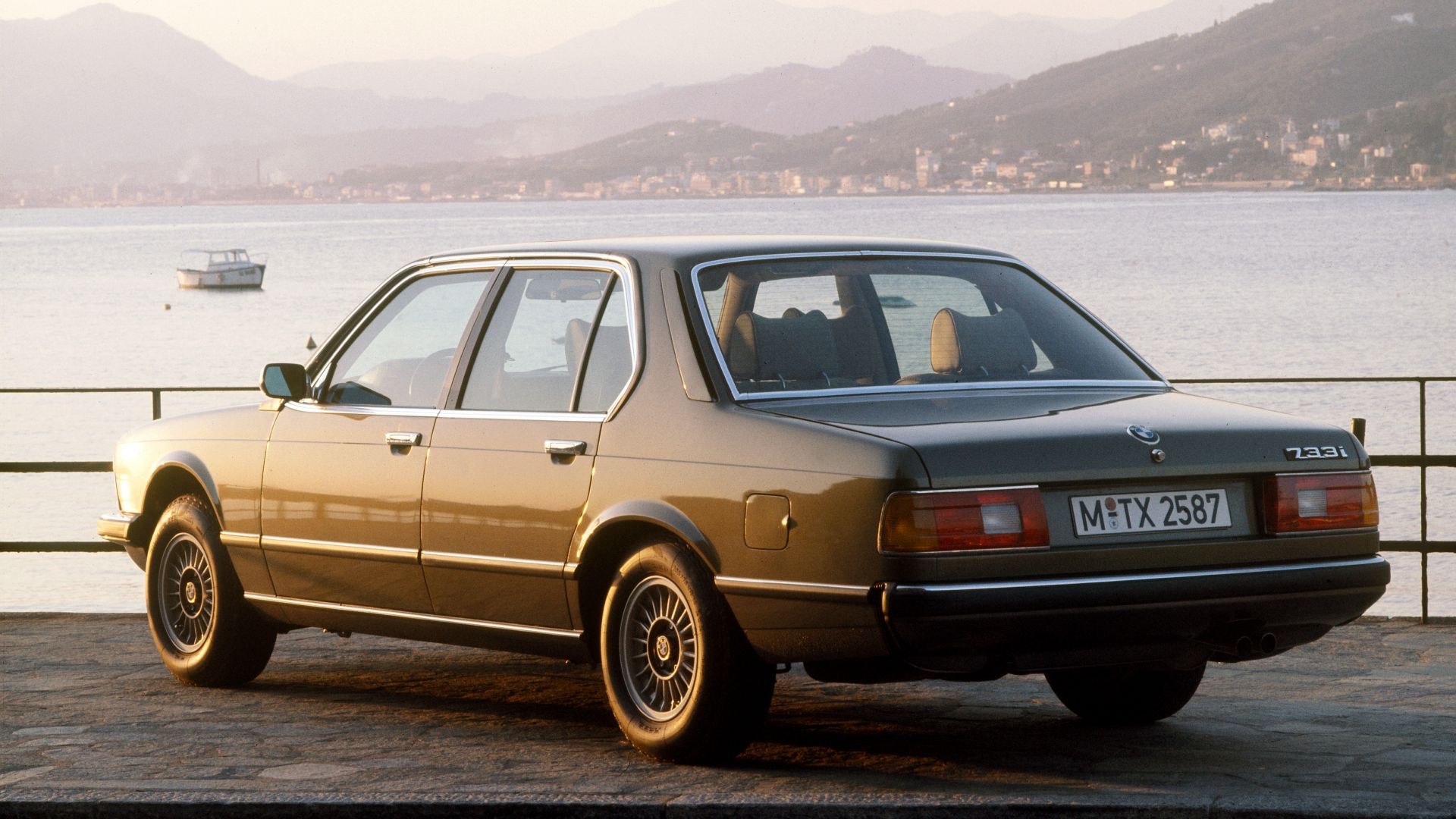 A rear 3/4 exterior shot of a E23 BMW 733i