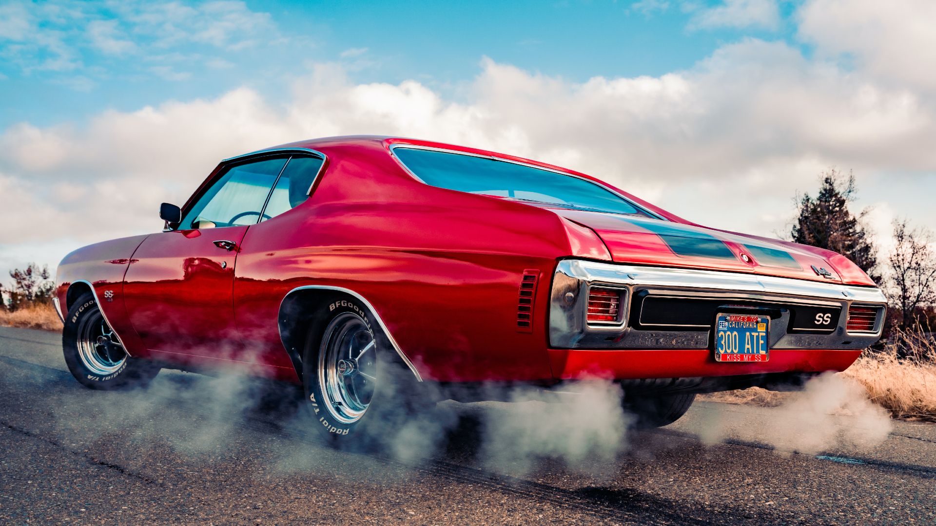 1970 Chevrolet Chevelle SS doing a burnout on a empty street