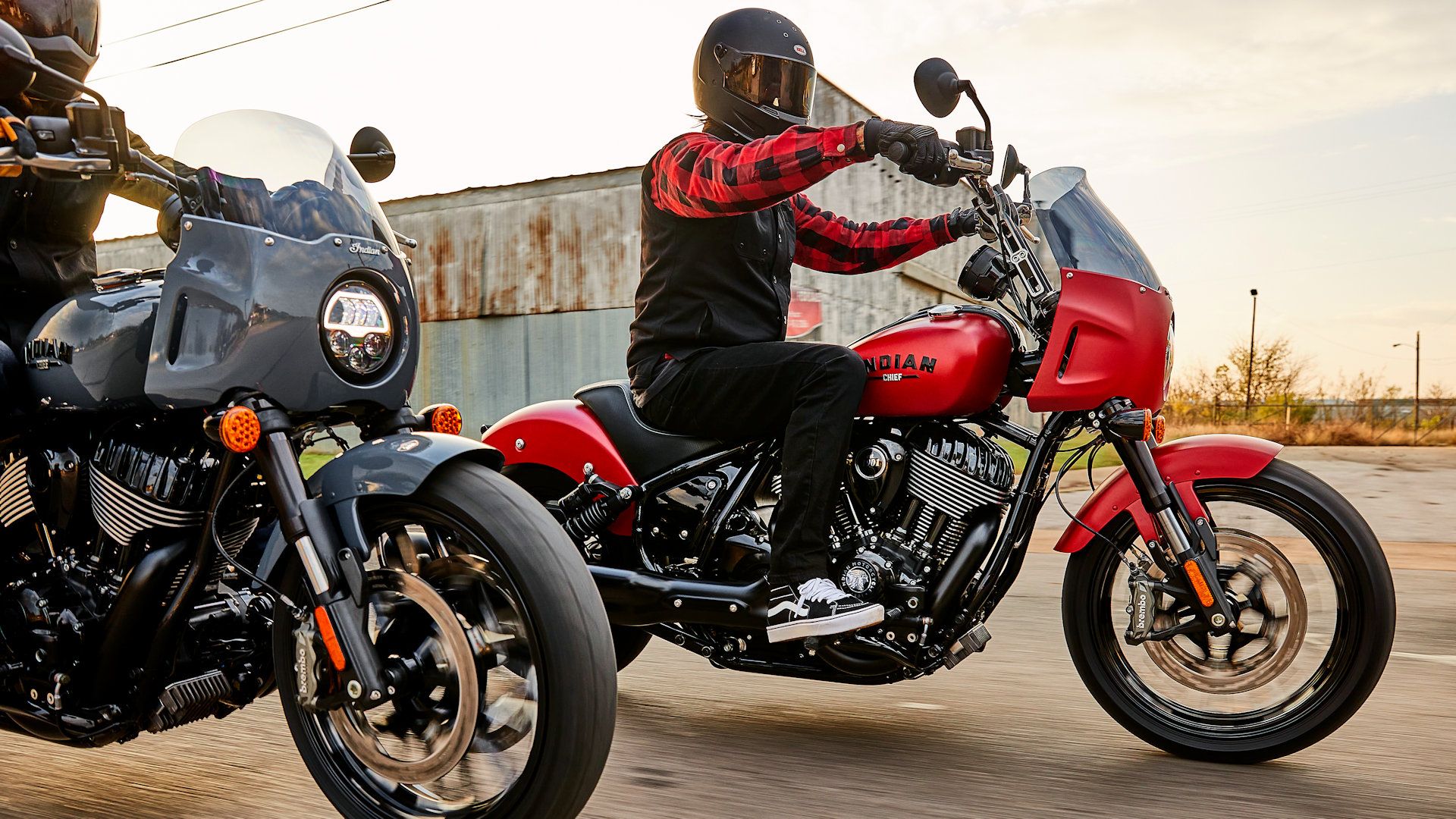 Rider on an accessorized red 2023 Indian Sport Chief