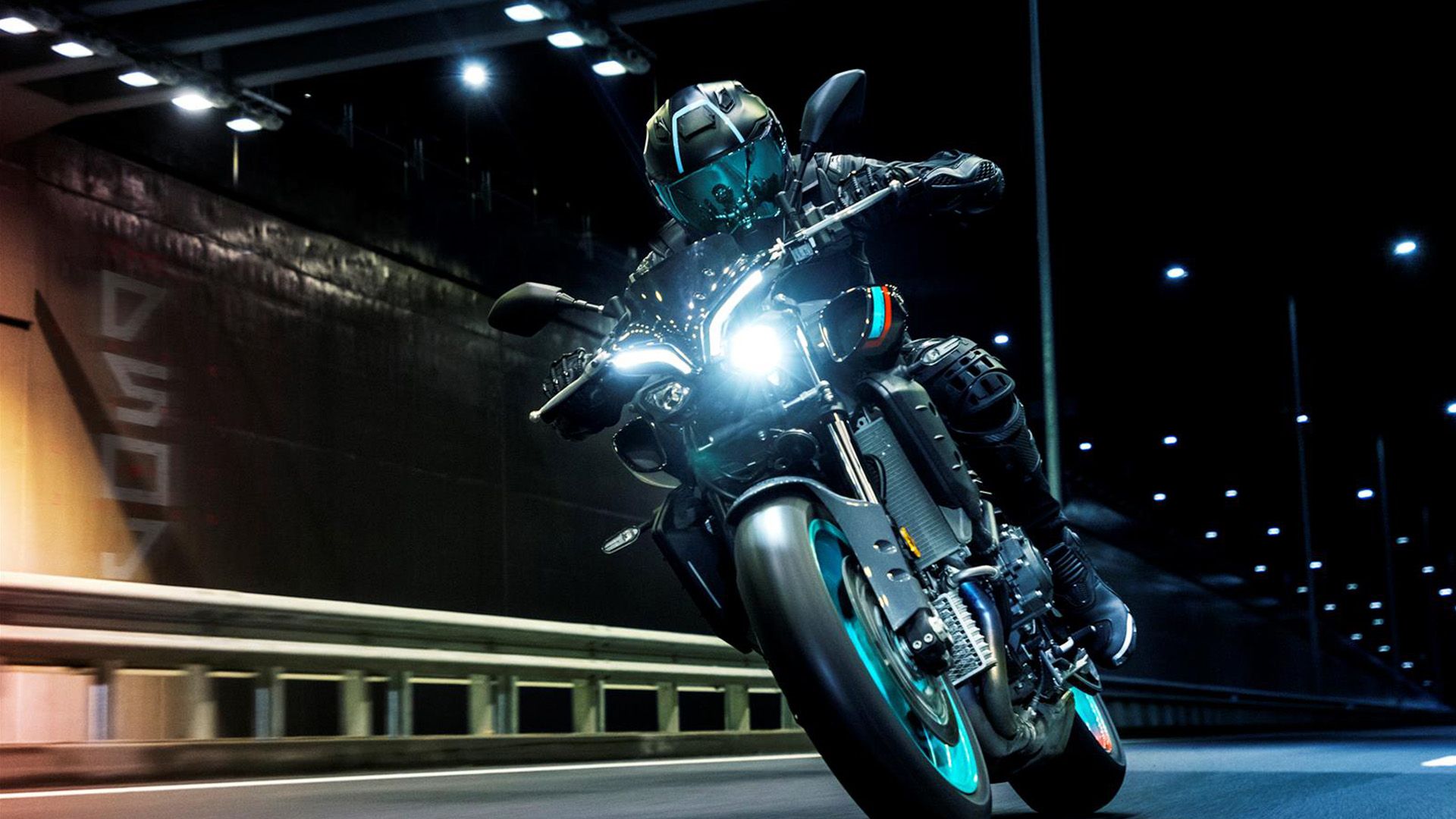 2023 Yamaha MT-10 naked bike action shot at night front view.