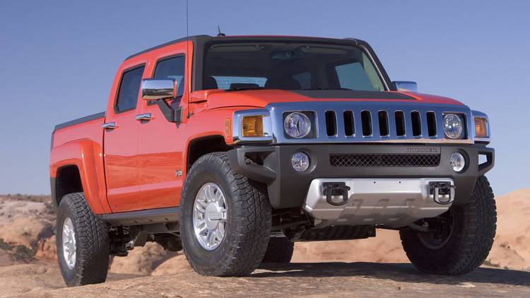 A front 3/4 shot of the 2009 Hummer H3T Alpha conquering rocky terrain
