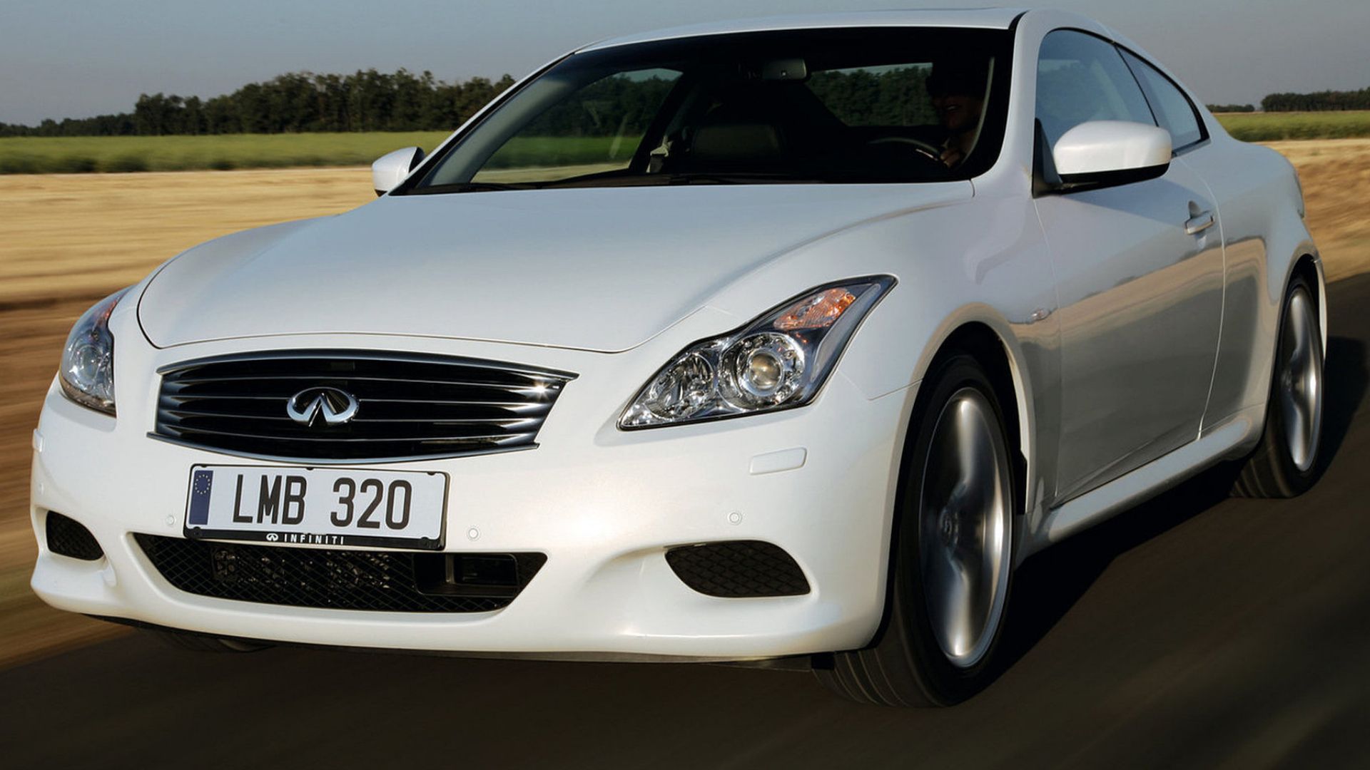 2009 Infiniti G37 in white Posing on road in countryside