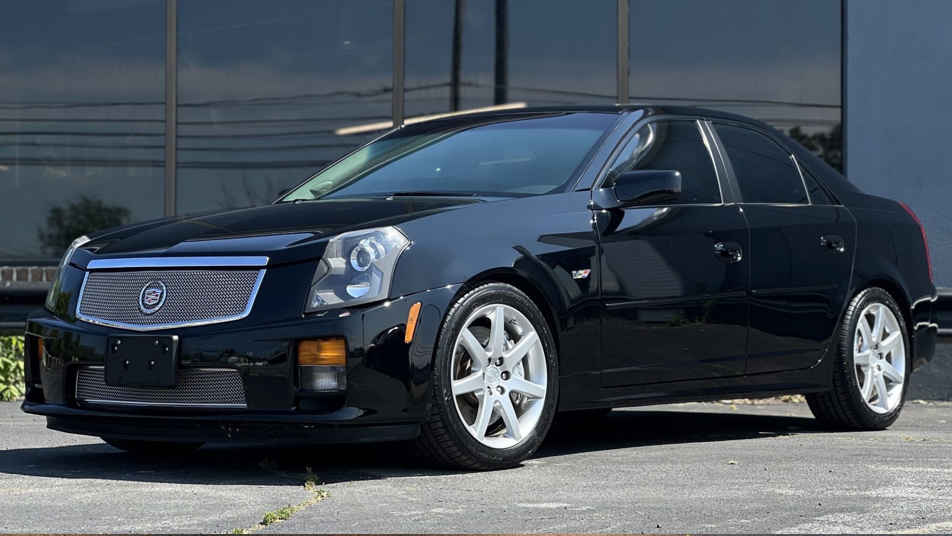 2004 Cadillac CTS-V in black posing in front of office building