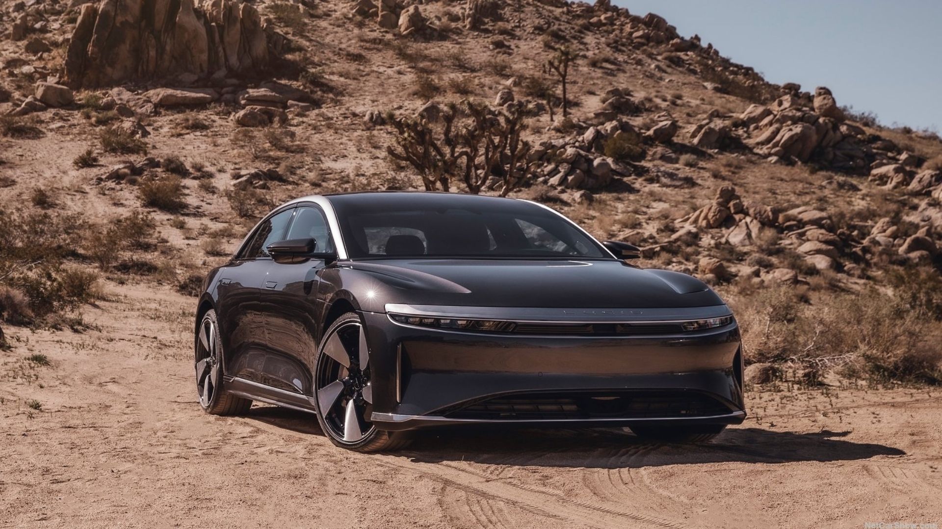 Lucid Air Touring on a desert road