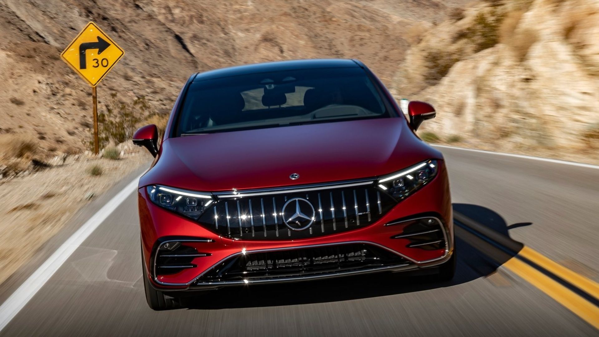 Mercedes-AMG EQS driving on road in desert