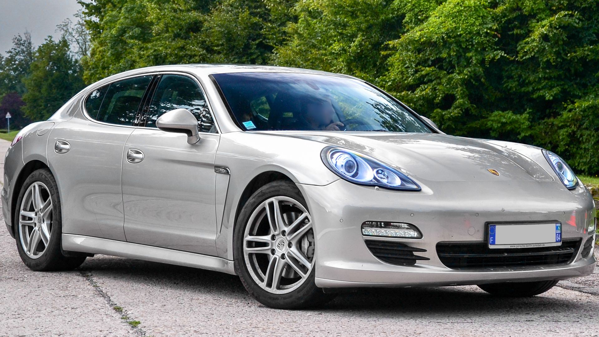 A Silver 2013 Porsche Panamera S parked at roadside 