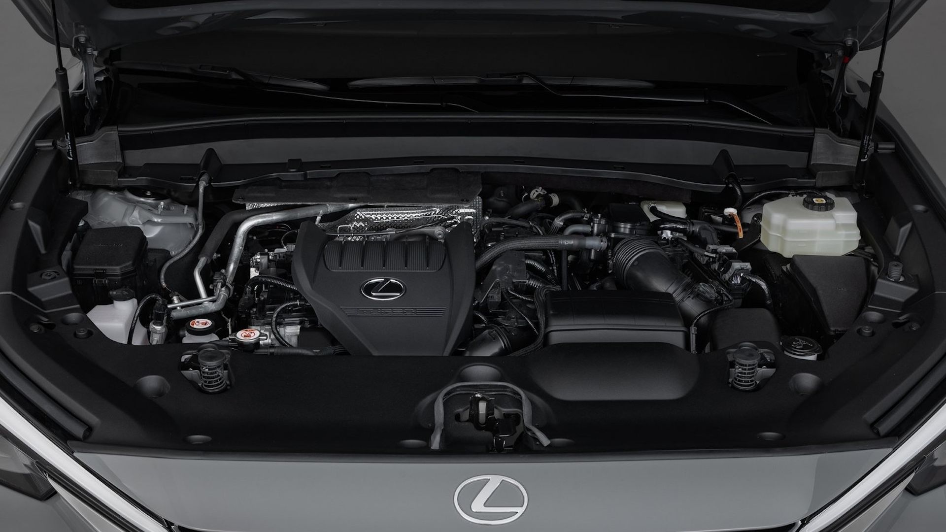 The engine bay with the hood open of a 2024 Lexus TX 