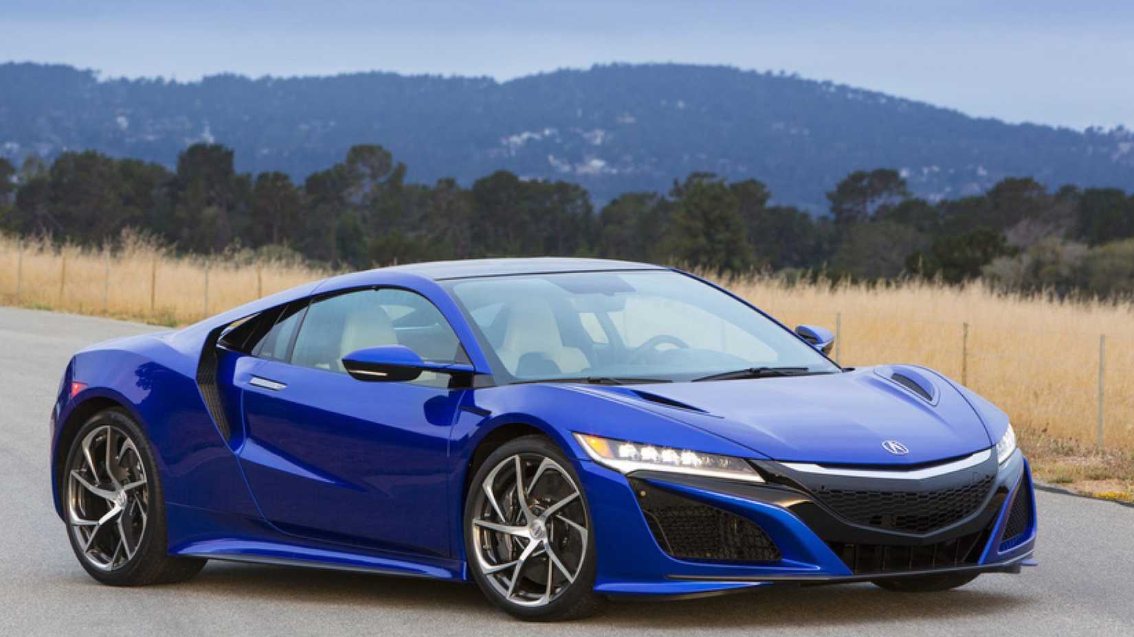 2016 Acura NSX in blue posing on road in front of mountains and trees