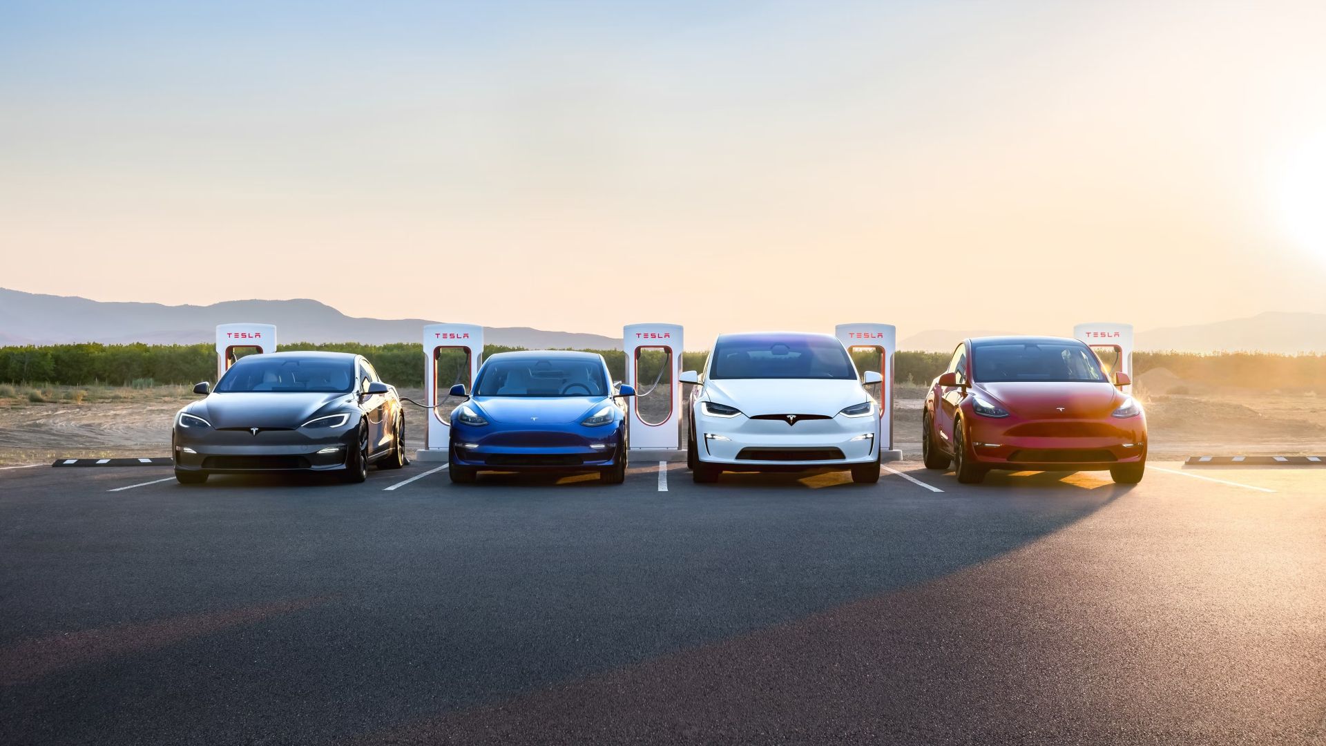 A front shot of 2023 Tesla's Lineup plugged in