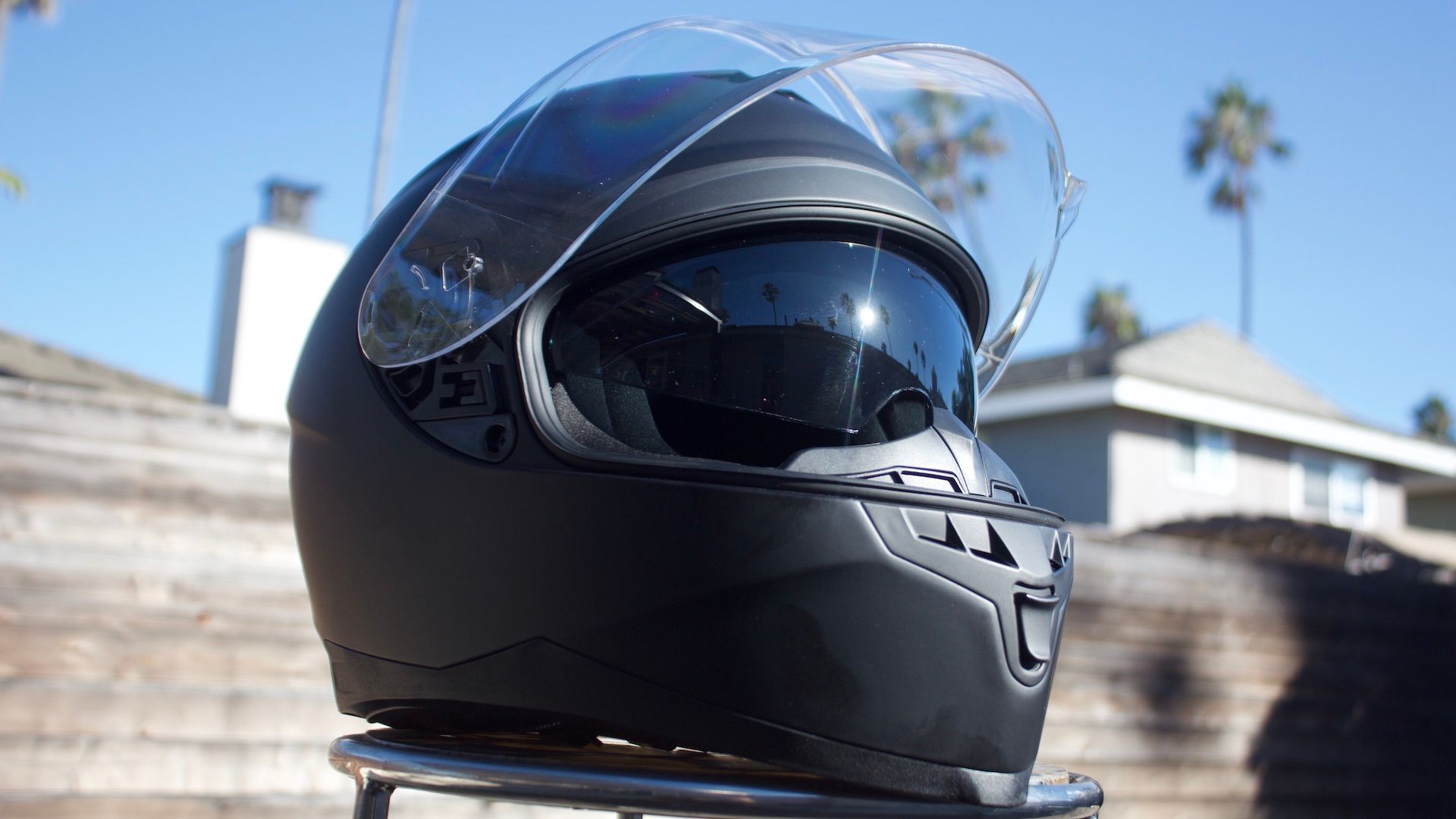 FreedConn helmet on stand with shield up and visor down