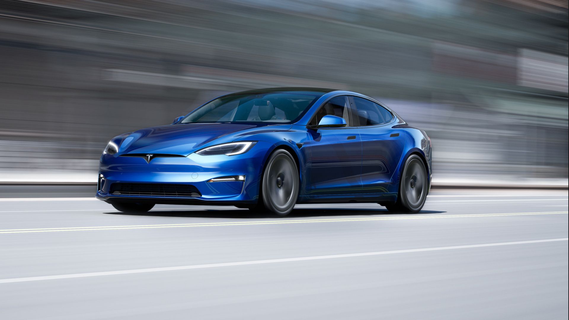 2023 Tesla Model S in blue posing on road 