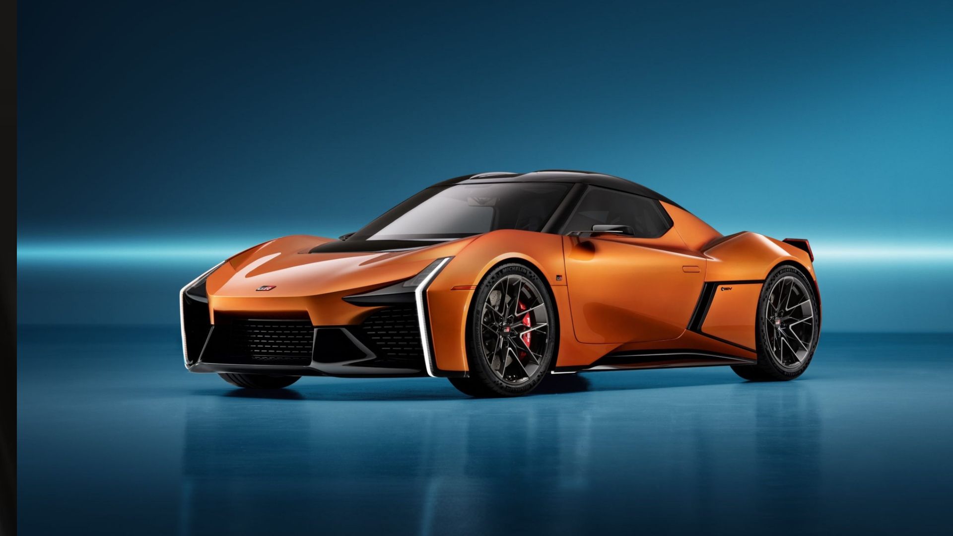Toyota FT-Se all electric sports concept car in orange posing in studio 