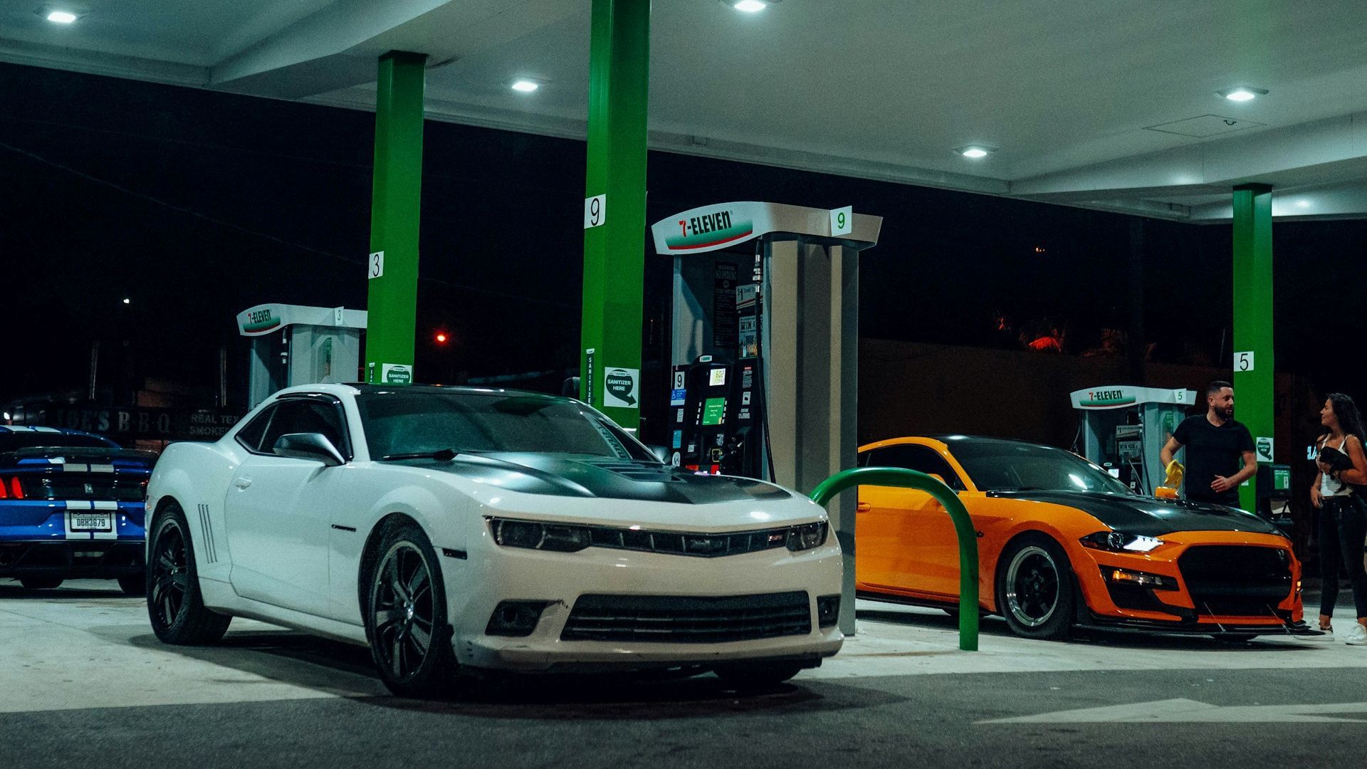 Muscle Cars At A Gas Station Night