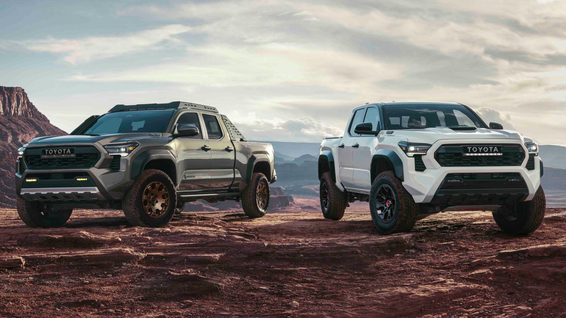 two 2024 Toyota Tacoma's parked on a mountain top