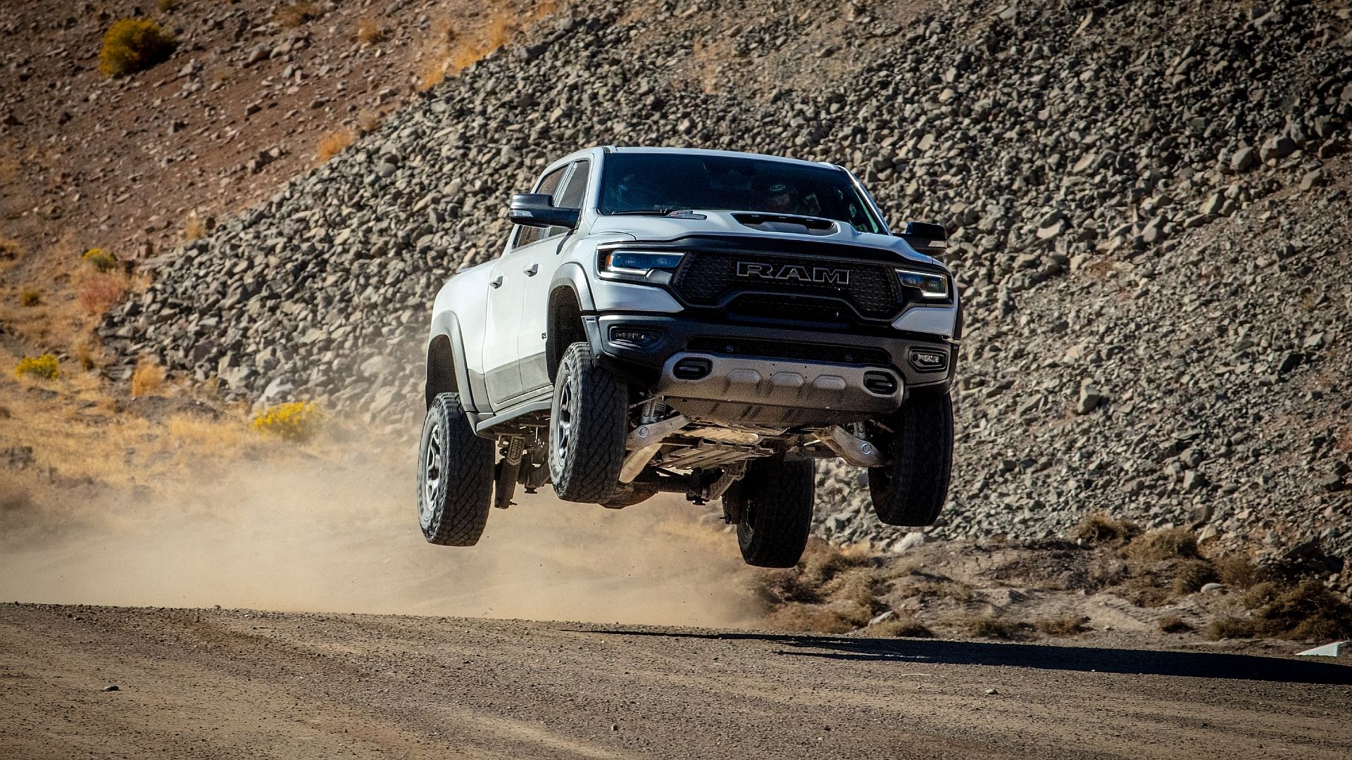 2024 Ram 1500 catching air on a gravel road