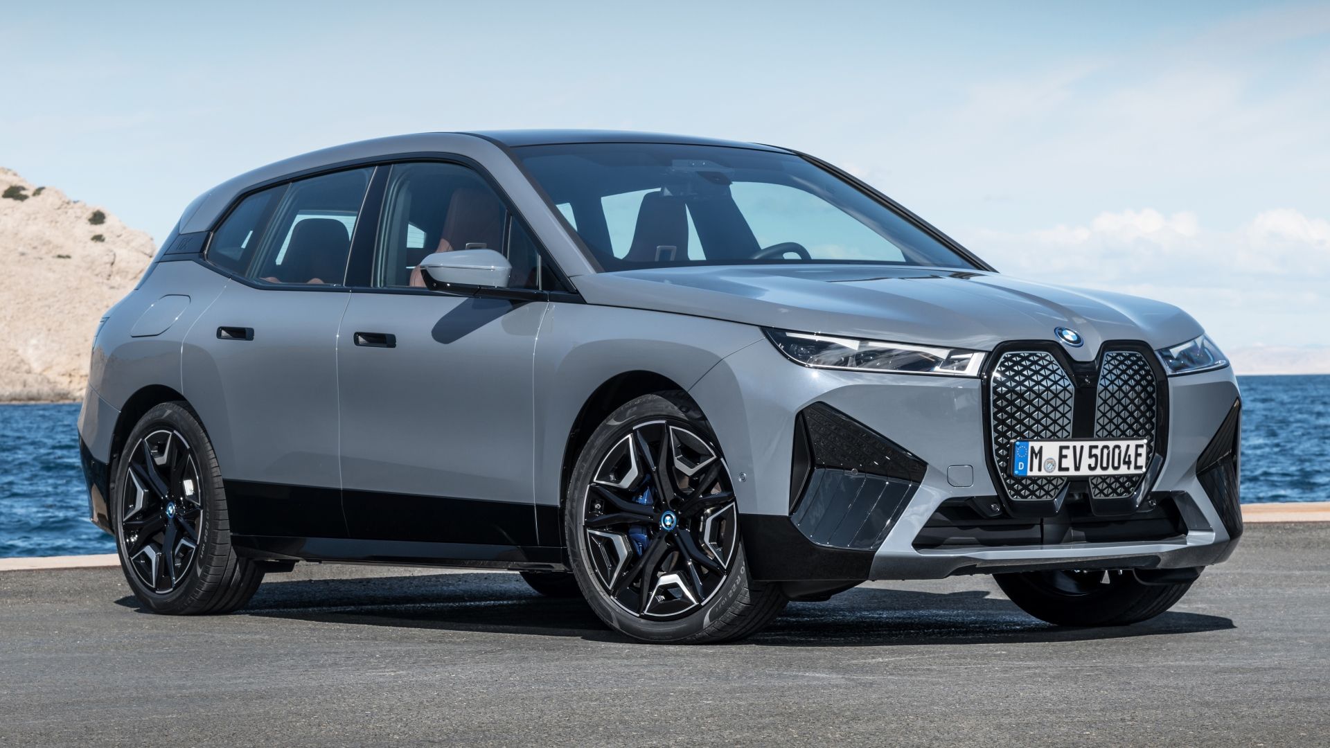 Gray BMW iX xDrive50 front-quarter parked