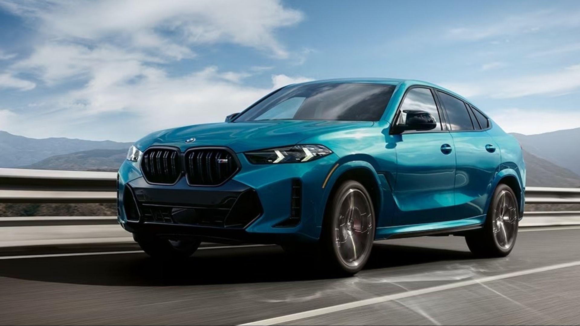 A BMW X6 in iconic BMW blue on the road