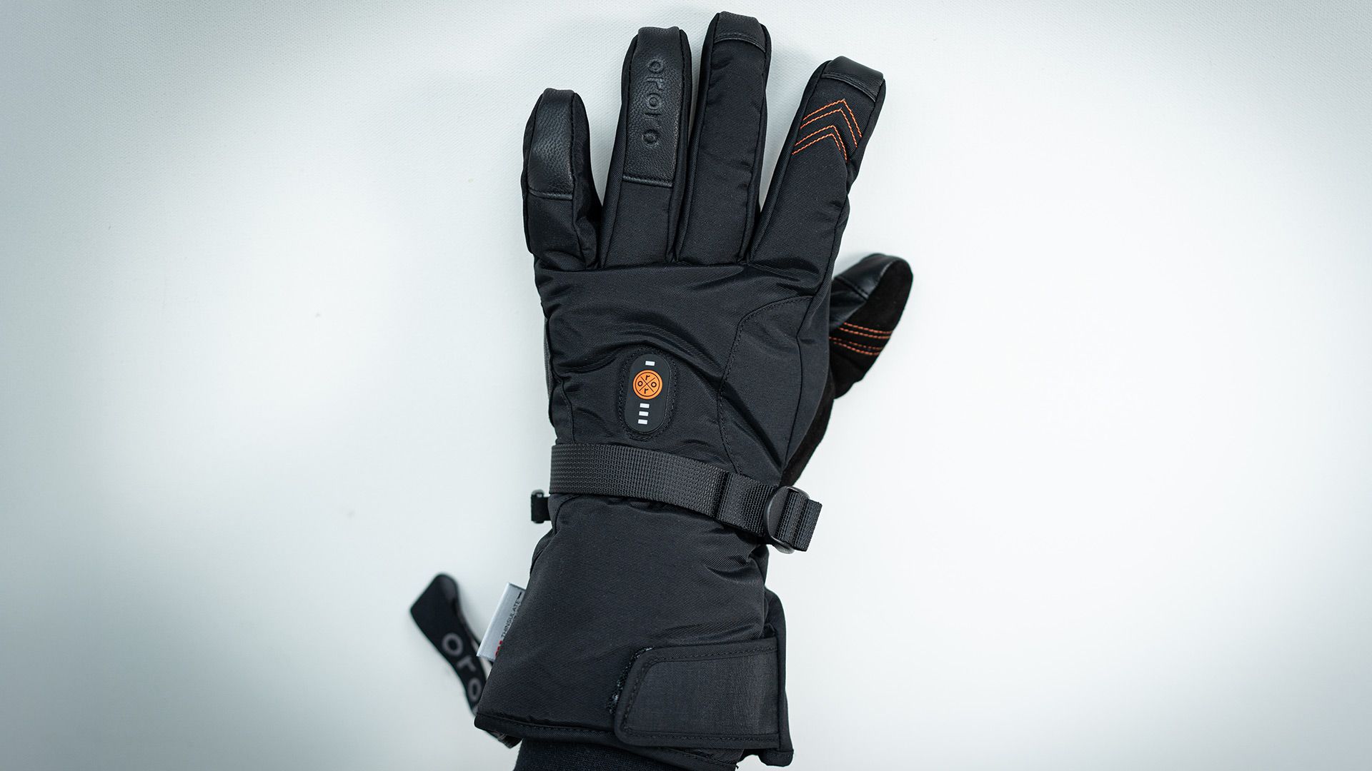 Photograph of ORORO Heated Gloves backside, power button, wrist strap and cuff strap.