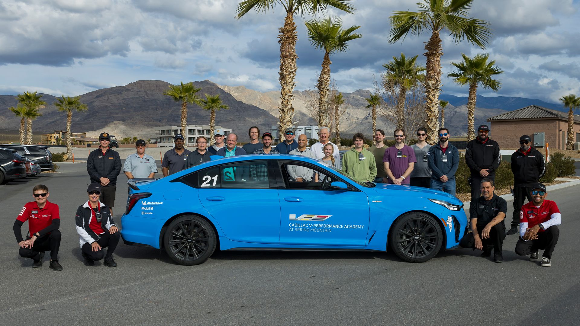 Driving students surrounding 2023 Cadillac CT5-V Blackwing