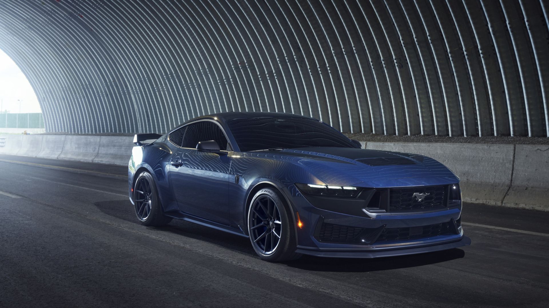 2024 Ford Mustang Dark Horse in blue driving through tunnel