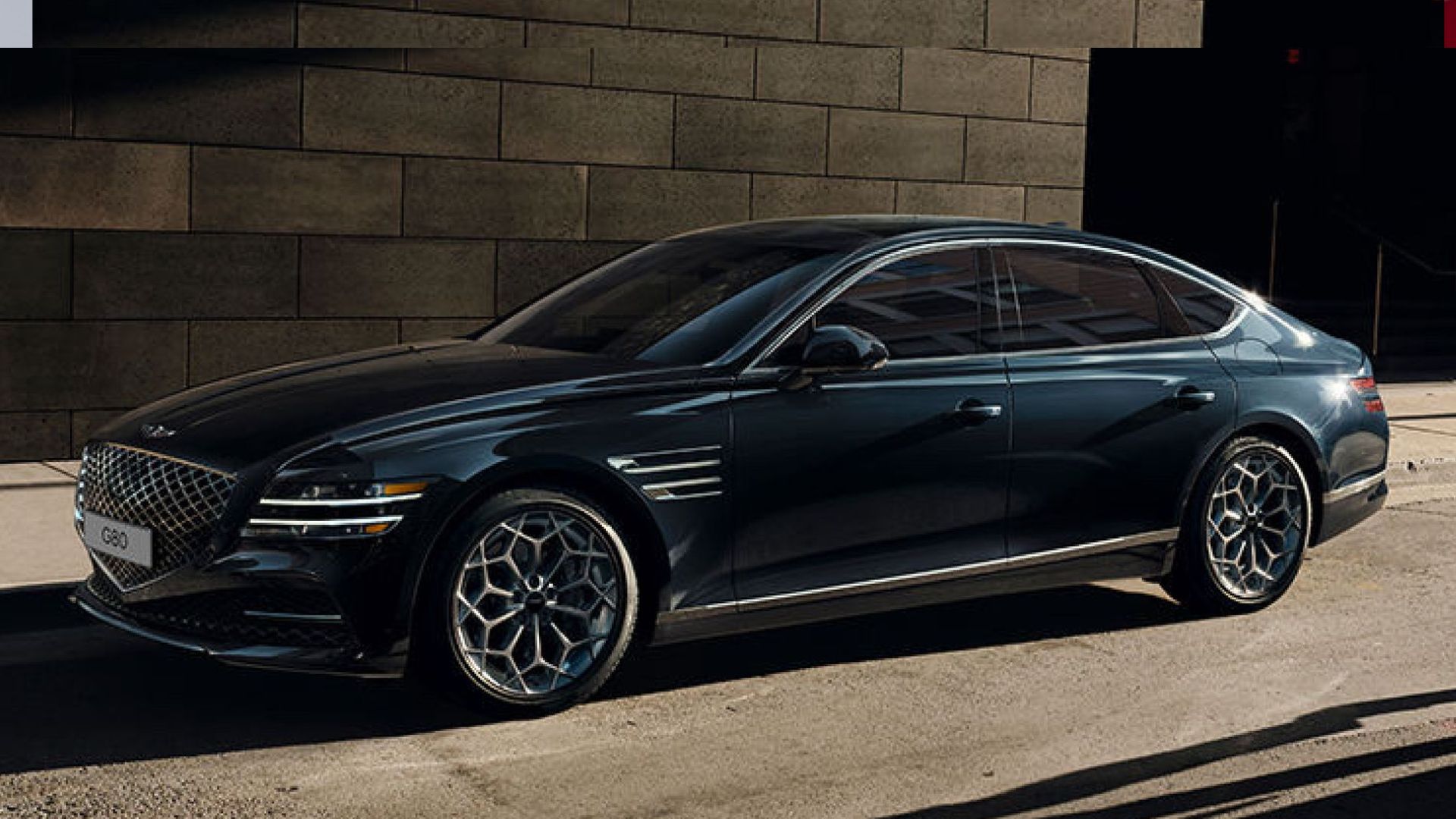 2024 Genesis G80 in black posing on city street