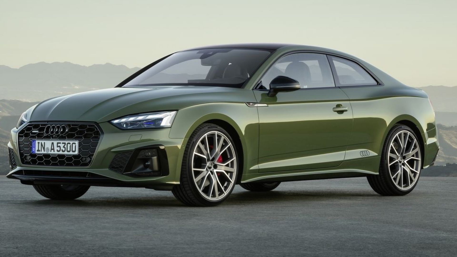 2024 Audi A5 Sportback Sedan in green posing in desert in front of mountain range