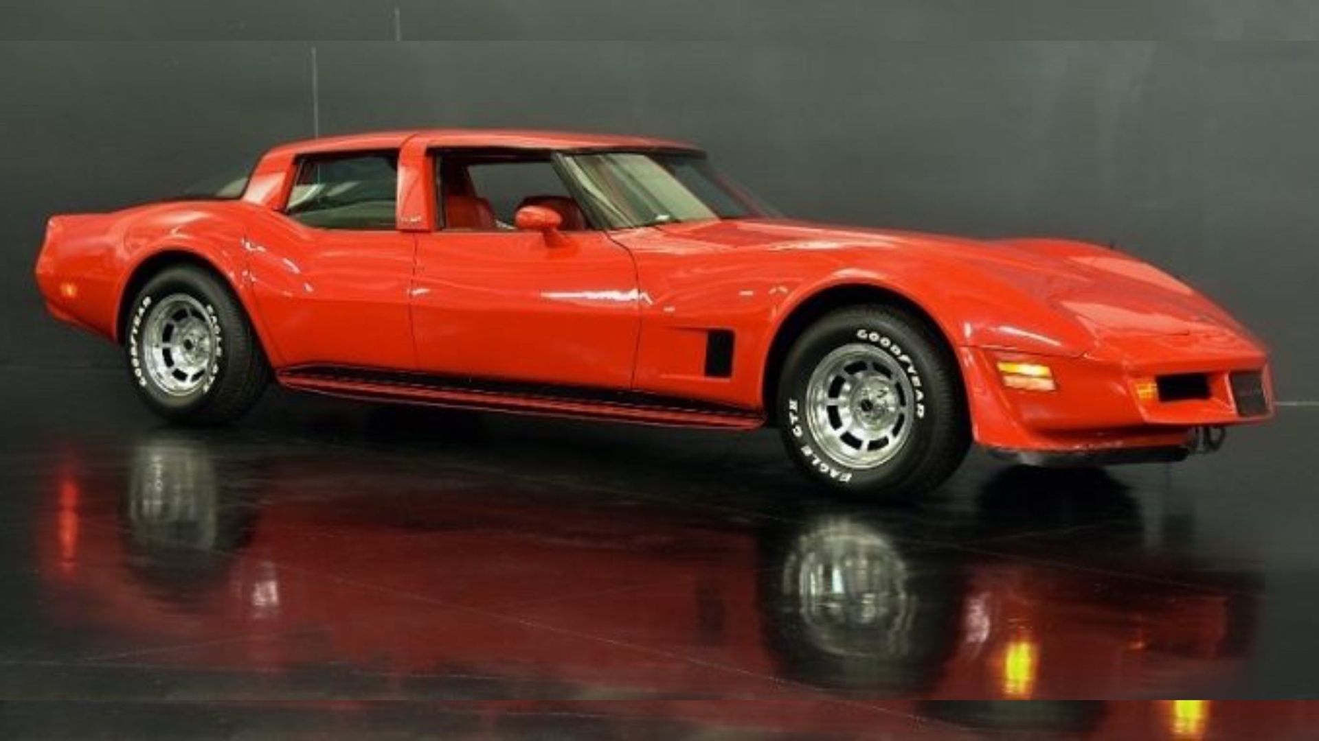 Red four-door Corvette